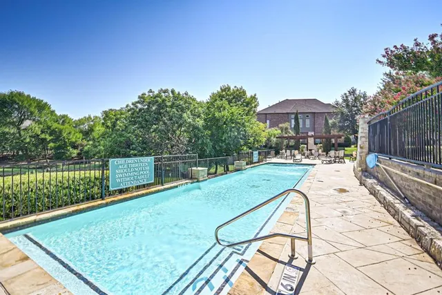 a view of swimming pool with a patio