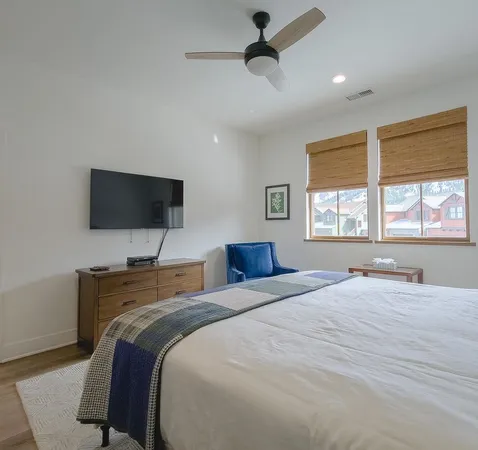 a view of a livingroom with furniture and a flat screen tv
