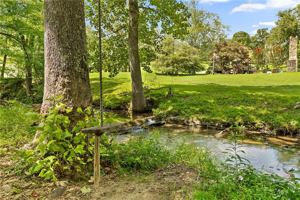 0 Maple Hill Lane Chickamauga, GA 30707 - Photo 12 of 39 a view of a garden with a bench