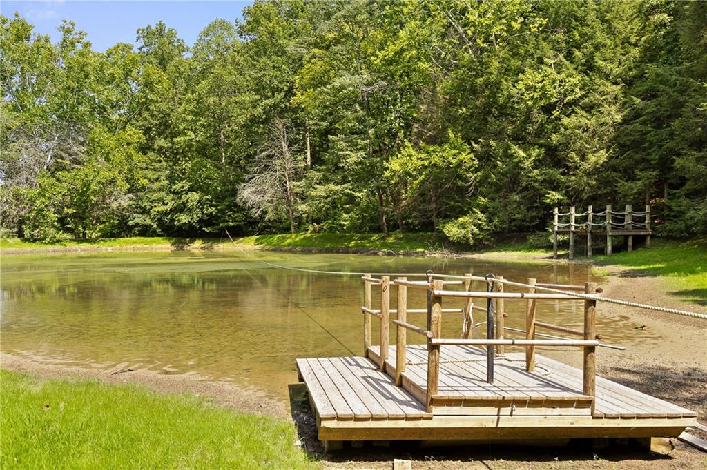0 Maple Hill Lane Chickamauga, GA 30707 - Photo 16 of 39 a view of a lake with a house in the background