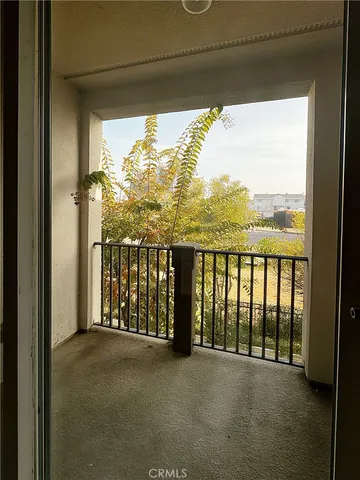 a view of balcony with furniture