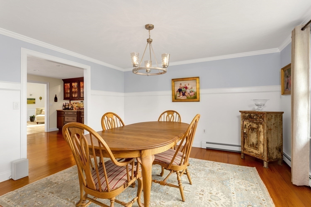 1 Delta Drive Franklin, MA 02038 - Photo 15 of 42 a dining room with furniture a chandelier and wooden floor