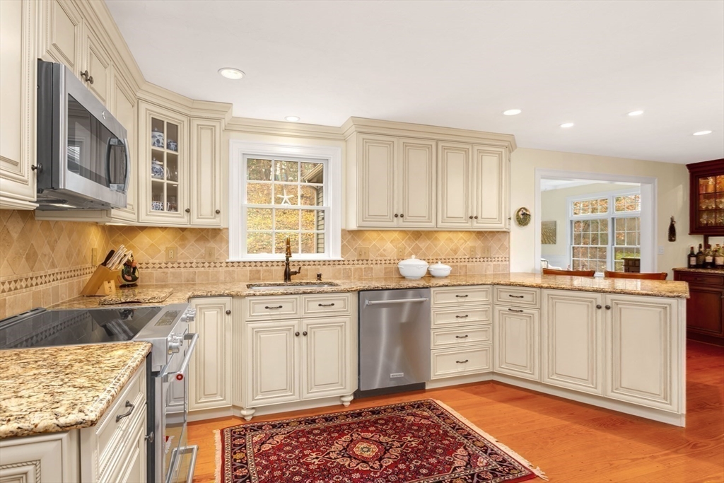 1 Delta Drive Franklin, MA 02038 - Photo 2 of 42 a kitchen with stainless steel appliances granite countertop a stove a sink and a microwave