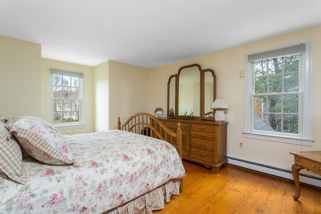 1 Delta Drive Franklin, MA 02038 - Photo 24 of 42 a bedroom with a bed and a dresser next to a window
