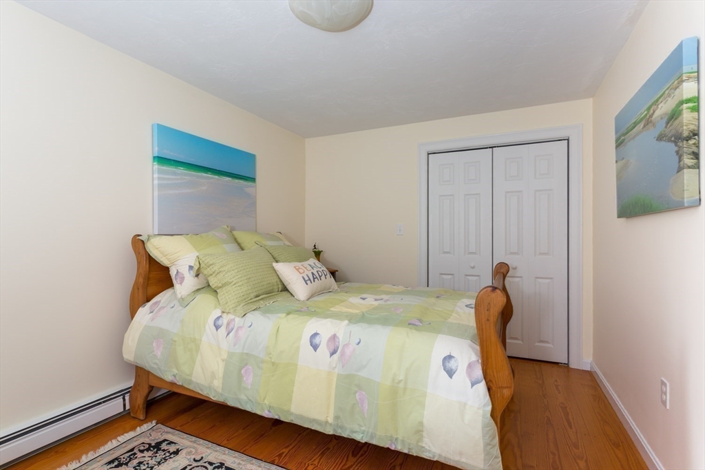 1 Delta Drive Franklin, MA 02038 - Photo 27 of 42 a bedroom with a bed and flat screen tv