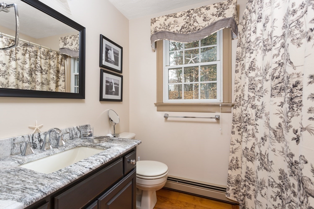 1 Delta Drive Franklin, MA 02038 - Photo 29 of 42 a bathroom with a granite countertop sink and a toilet