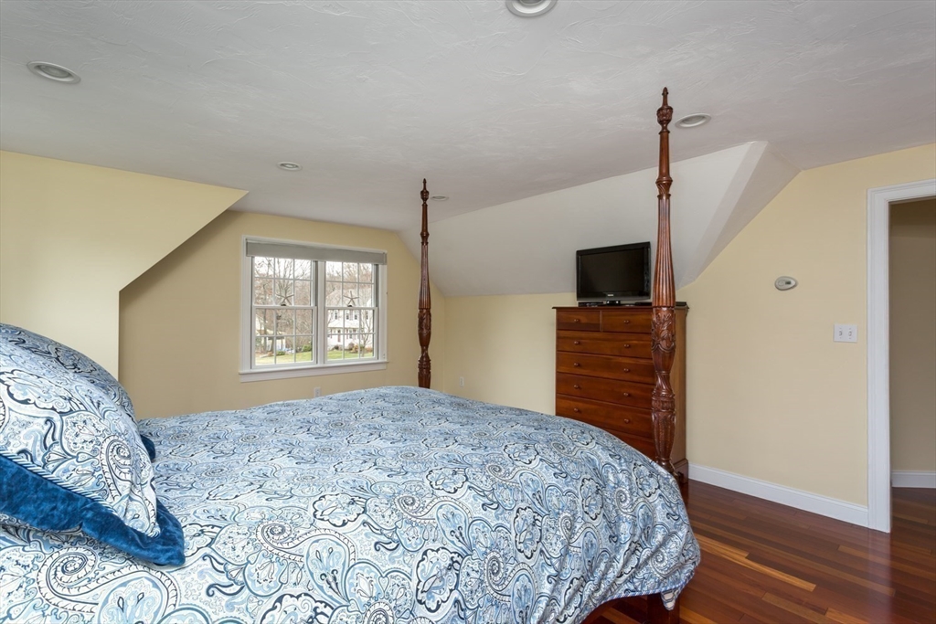 1 Delta Drive Franklin, MA 02038 - Photo 32 of 42 a bedroom with a bed and a flat screen tv