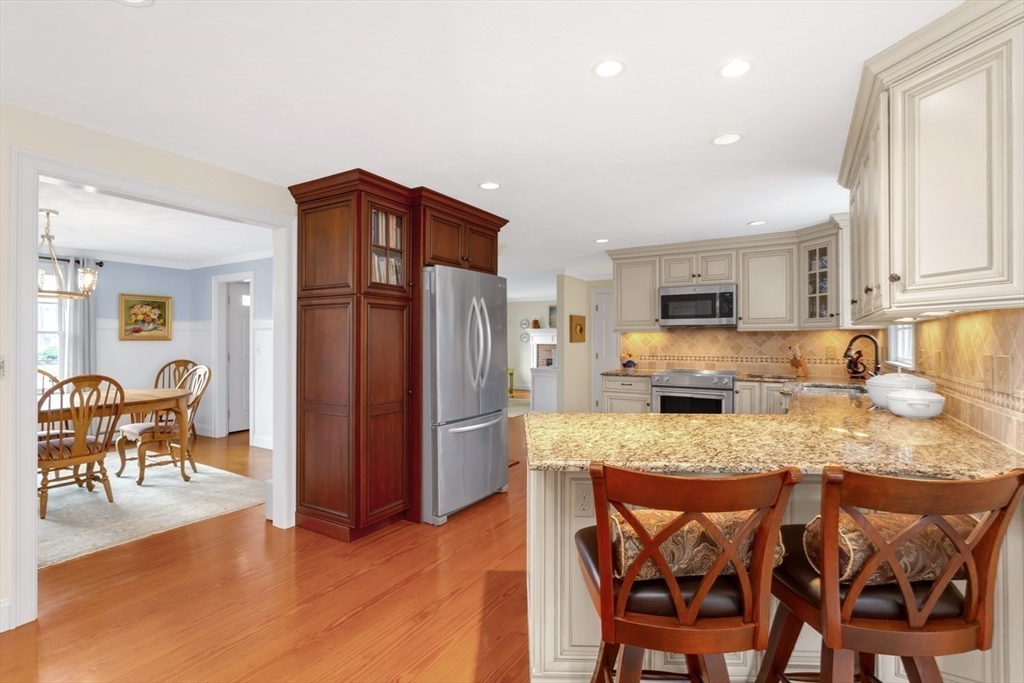 1 Delta Drive Franklin, MA 02038 - Photo 4 of 42 a kitchen with granite countertop cabinets and stainless steel appliances