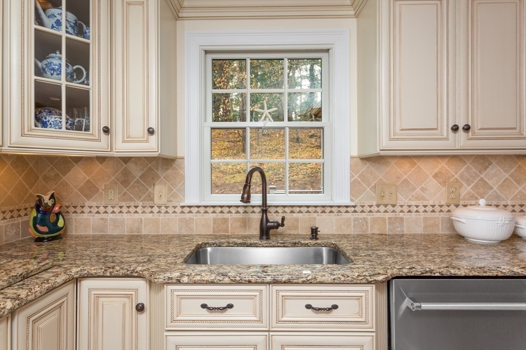1 Delta Drive Franklin, MA 02038 - Photo 8 of 42 a kitchen with granite countertop a sink and a window