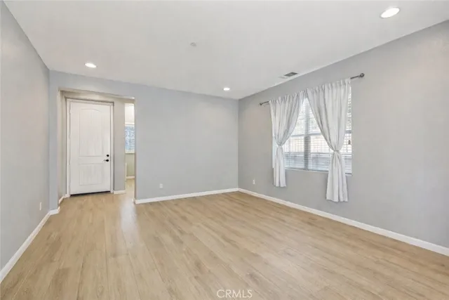 a white toilet sitting next to a window