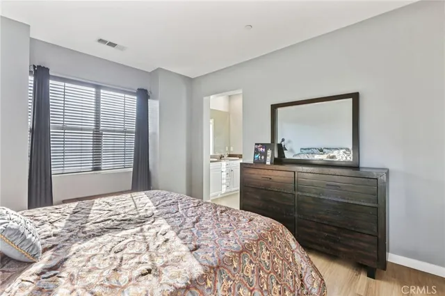 a spacious bathroom with a granite countertop sink toilet and shower