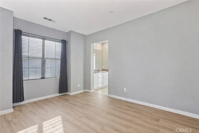 a bathroom with a double vanity sink toilet and a mirror