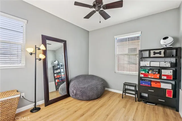 a view of a room with wooden floor and cabinet