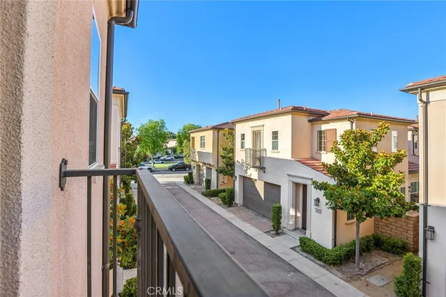 a view of a tables and chairs under an umbrella