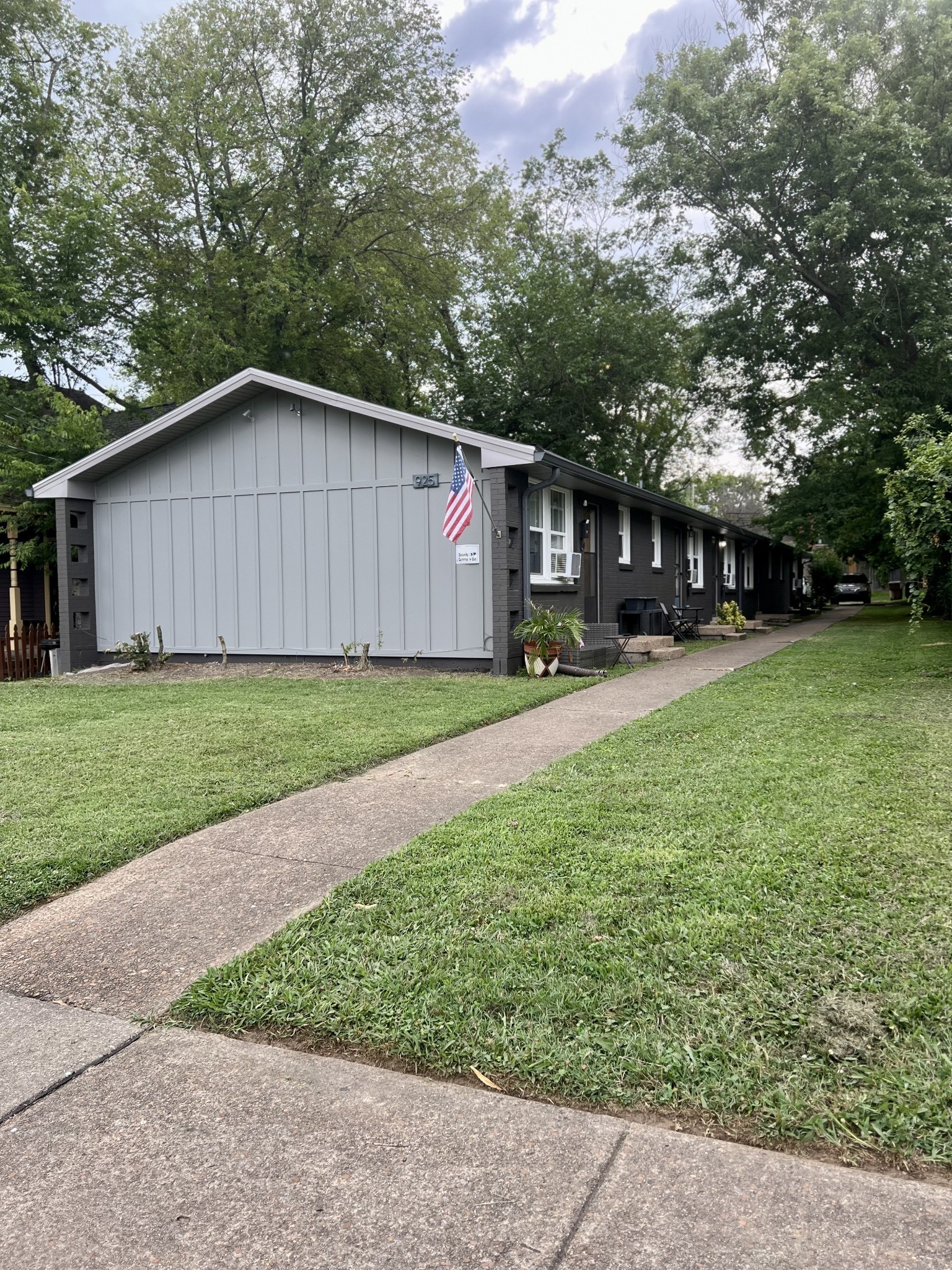 925 Boscobel Street, Unit 3 Nashville, TN 37206 - Photo 2 of 14 a backyard of a house with table and chairs