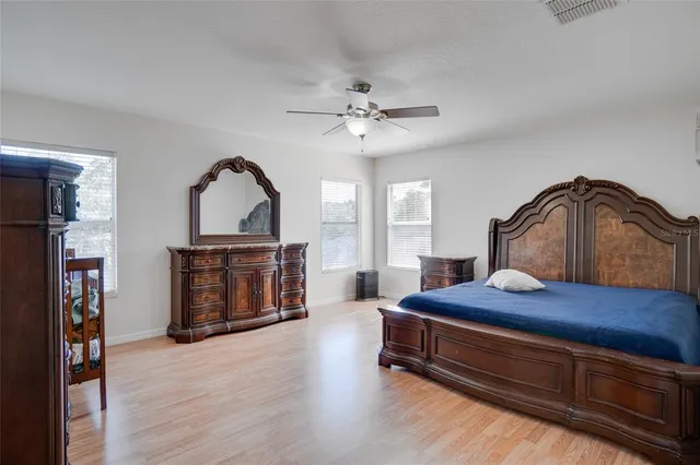 a bedroom with furniture and a fireplace
