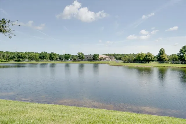 a view of a lake with houses in the back