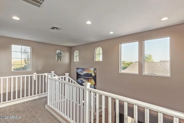 a view of a hallway with windows