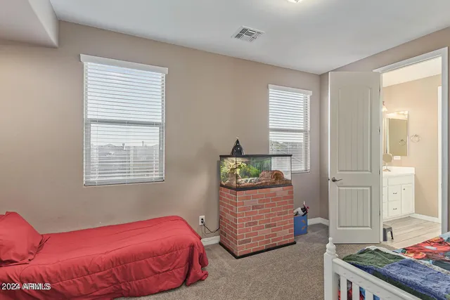 a bedroom with a bed and window