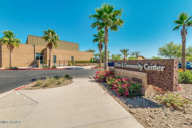 a view of a table and chairs in front of a house