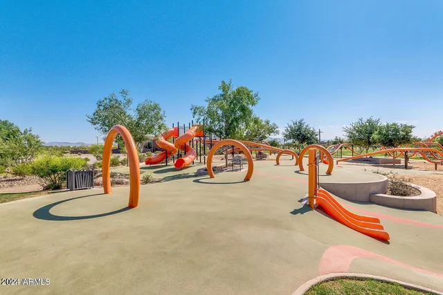 swimming pool view with a garden space