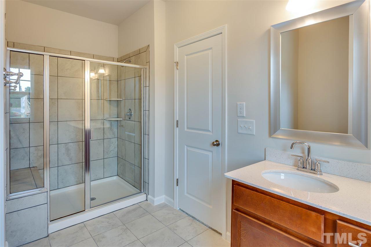 6033 Beale Loop, Unit 14 Raleigh, NC 27616 - Photo 11 of 18 oversized walk in shower.