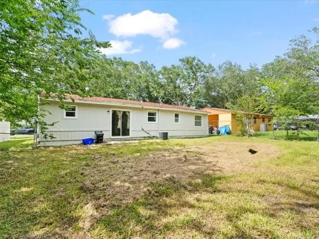 a house view with a sitting space and garden
