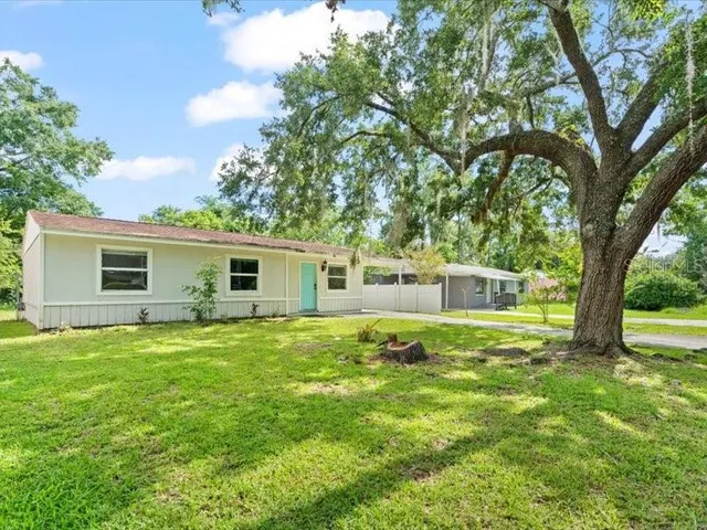 a backyard of a house with seating space