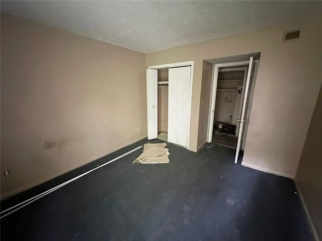 a view of an empty room and window