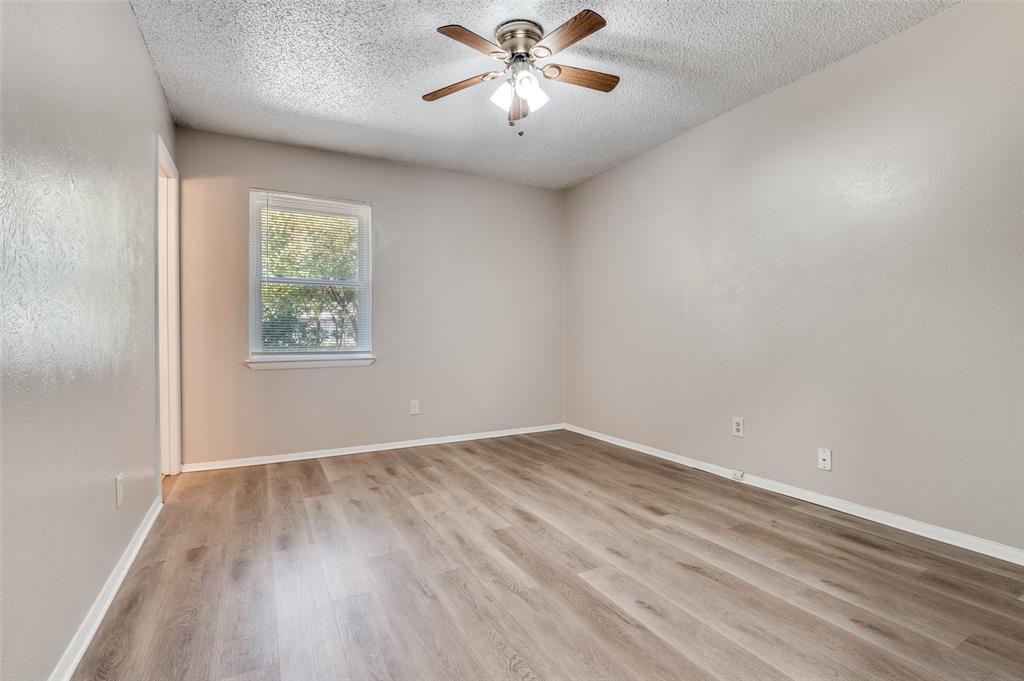 735 Middale Road Duncanville, TX 75116 - Photo 15 of 25 wooden floor in an empty room with a window