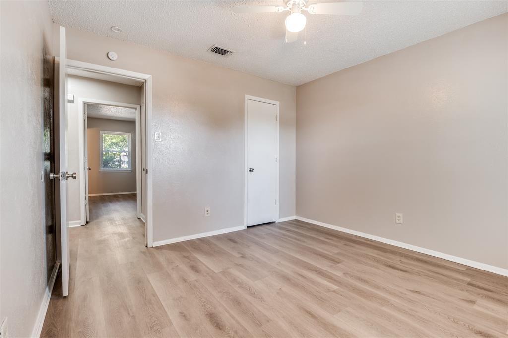 735 Middale Road Duncanville, TX 75116 - Photo 18 of 25 wooden floor in an empty room with a window