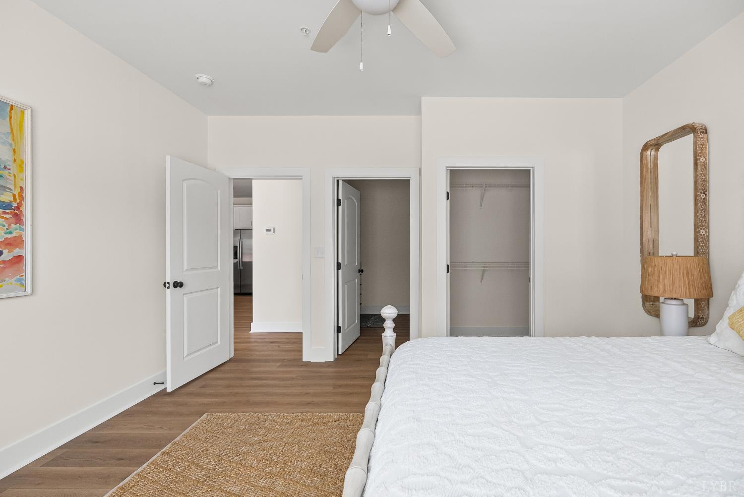 419 Rotunda Street, Unit 2006 Lynchburg, VA 24502 - Photo 15 of 23 a bedroom with a bed and a chandelier
