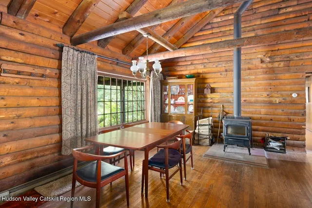 a view of a hallway with wooden shelves