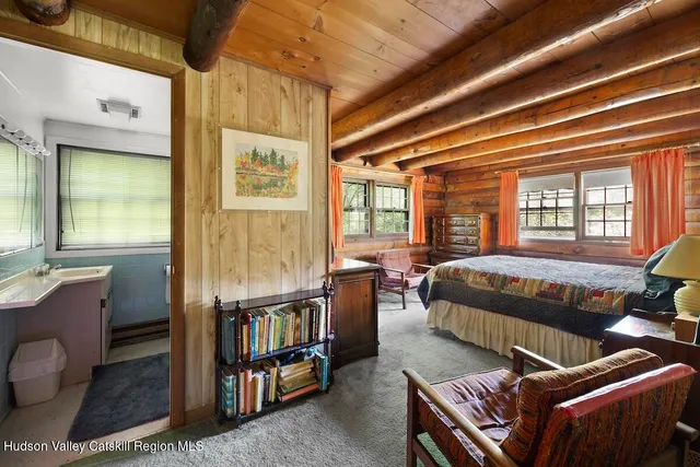 a bedroom with bed and a window