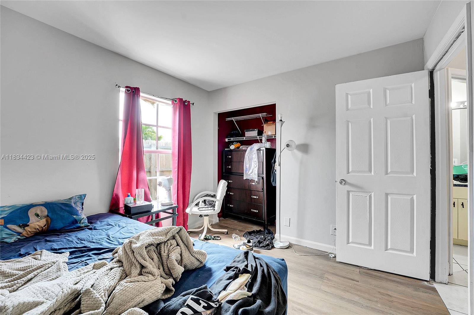 1303 West 6th Street Riviera Beach, FL 33404 - Photo 12 of 33 a bedroom with bed and a window