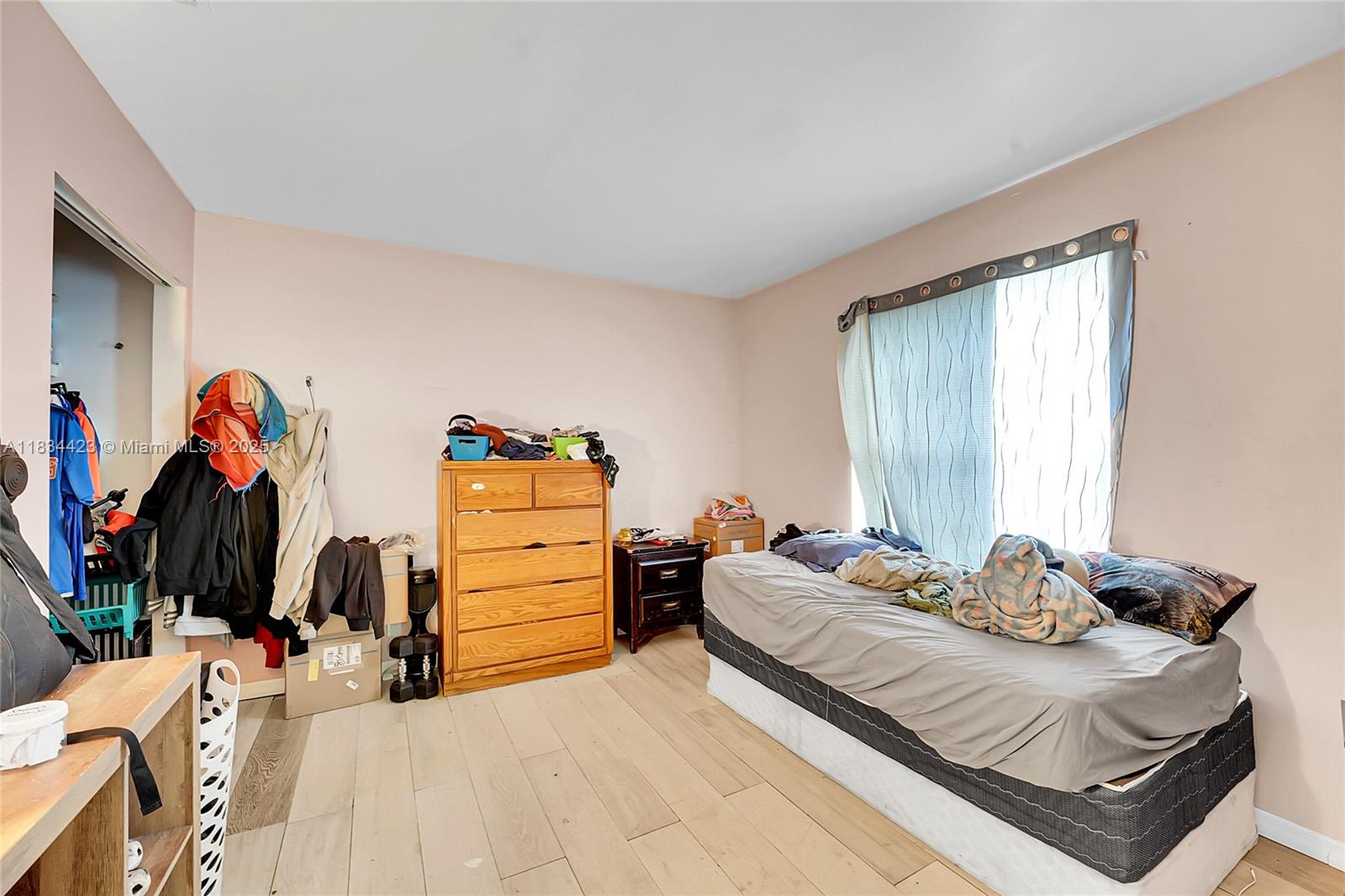 1303 West 6th Street Riviera Beach, FL 33404 - Photo 15 of 33 a bedroom with a bed and a closet