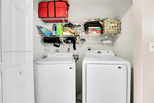 a utility room with dryer and washer