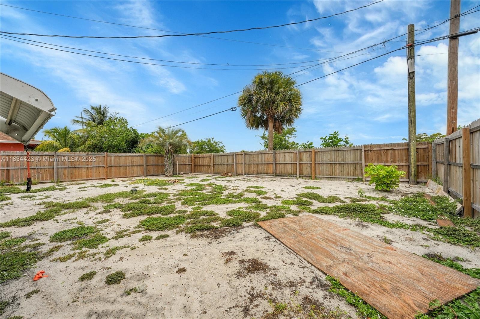 1303 West 6th Street Riviera Beach, FL 33404 - Photo 20 of 33 a view of a yard