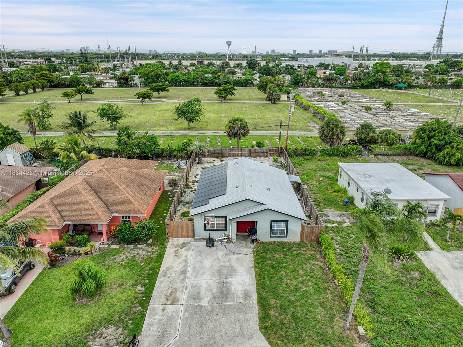 1303 West 6th Street Riviera Beach, FL 33404 - Photo 21 of 33 an aerial view of a house with yard and green space