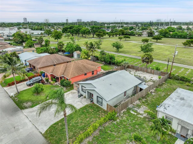 an aerial view of a house with outdoor space and street view