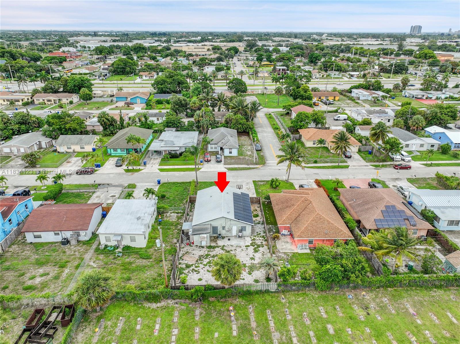 1303 West 6th Street Riviera Beach, FL 33404 - Photo 29 of 33 an aerial view of residential houses with outdoor space and swimming pool