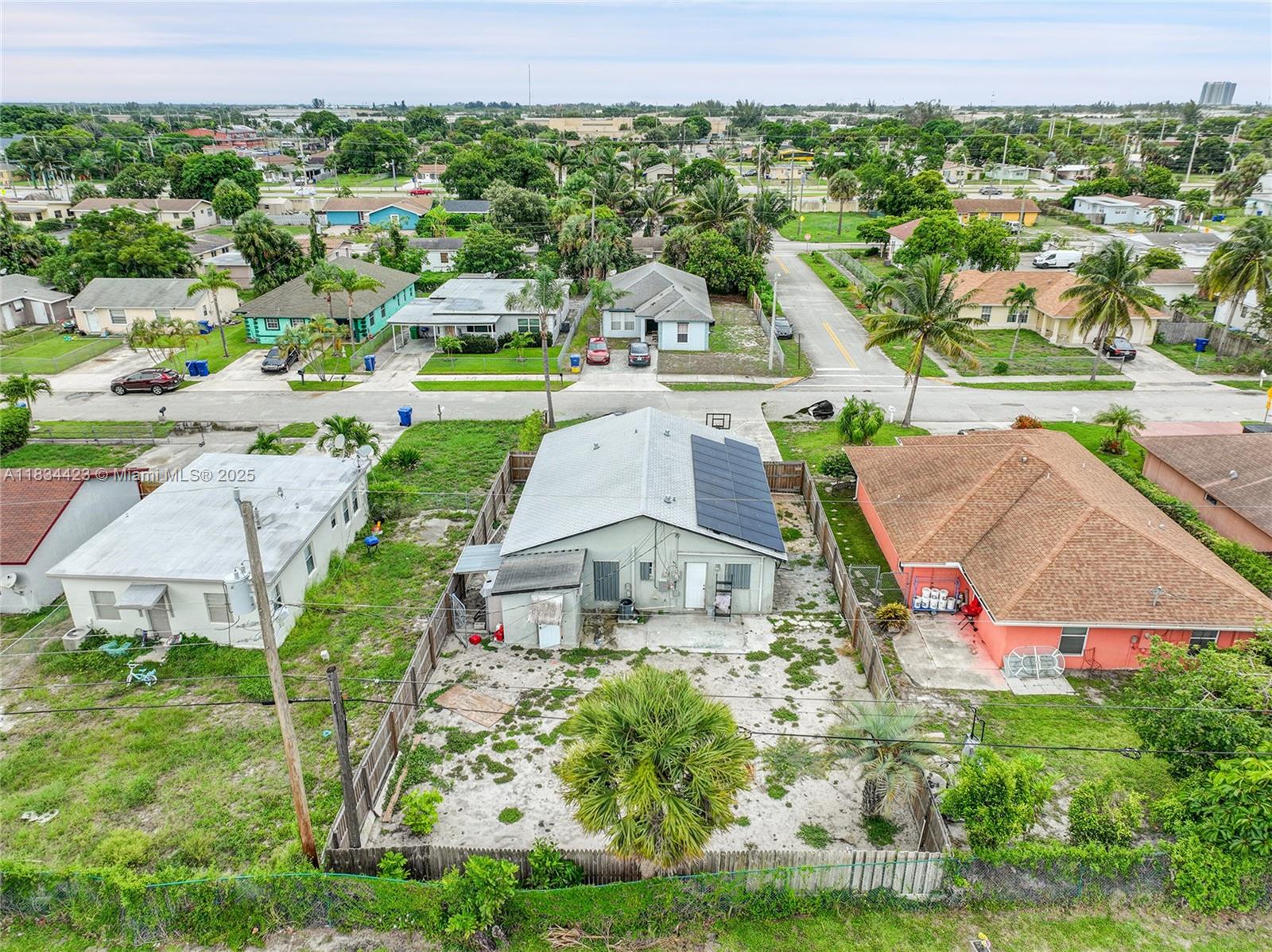 1303 West 6th Street Riviera Beach, FL 33404 - Photo 32 of 33 an aerial view of residential houses with outdoor space and trees