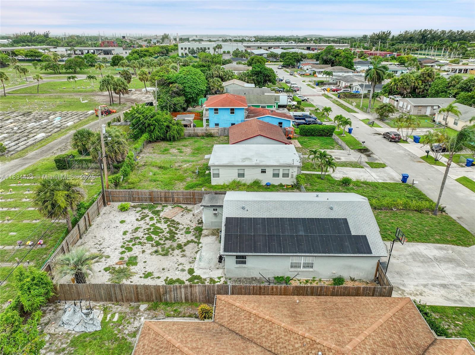 1303 West 6th Street Riviera Beach, FL 33404 - Photo 33 of 33 an aerial view of residential houses with outdoor space and swimming pool