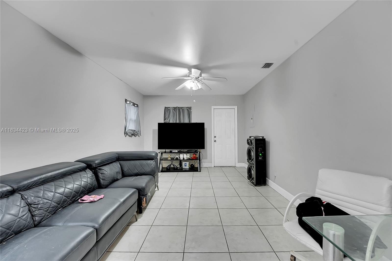 1303 West 6th Street Riviera Beach, FL 33404 - Photo 5 of 33 a living room with furniture and a flat screen tv
