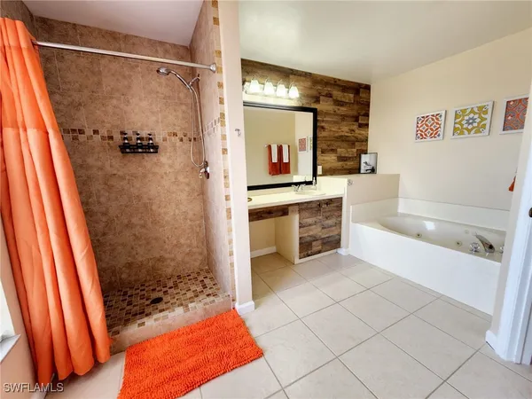 a bathroom with a bathtub and a shower
