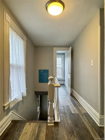 a view of entryway with wooden floor