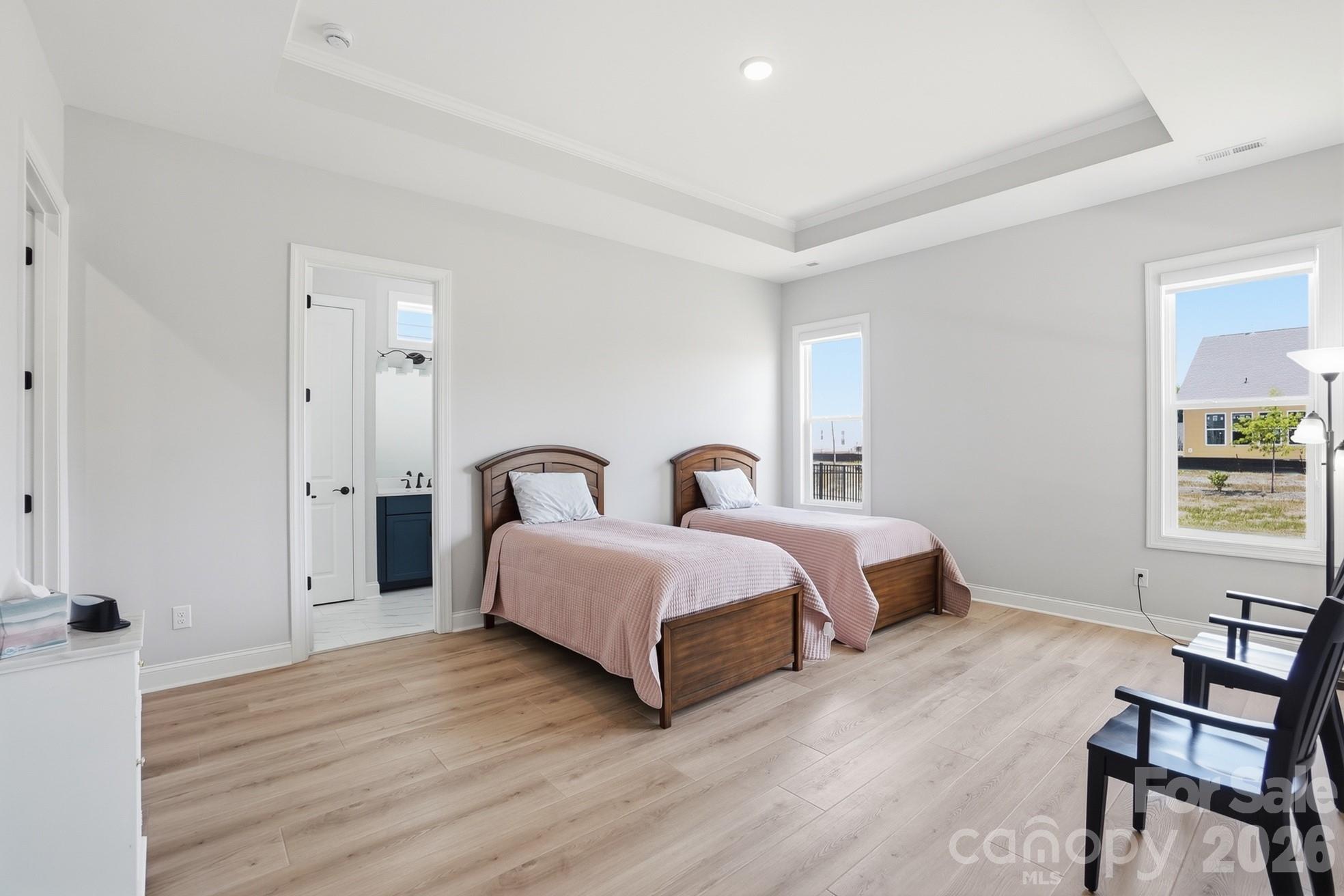 1035 Rabbit Hl Lane Monroe, NC 28110 - Photo 19 of 39 a spacious bedroom with a bed and a window