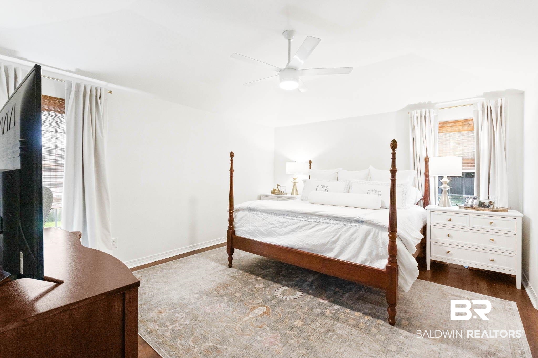 20685 Lowry Drive Fairhope, AL 36532 - Photo 25 of 48 Bedroom featuring multiple windows, dark wood-style flooring, and a ceiling fan