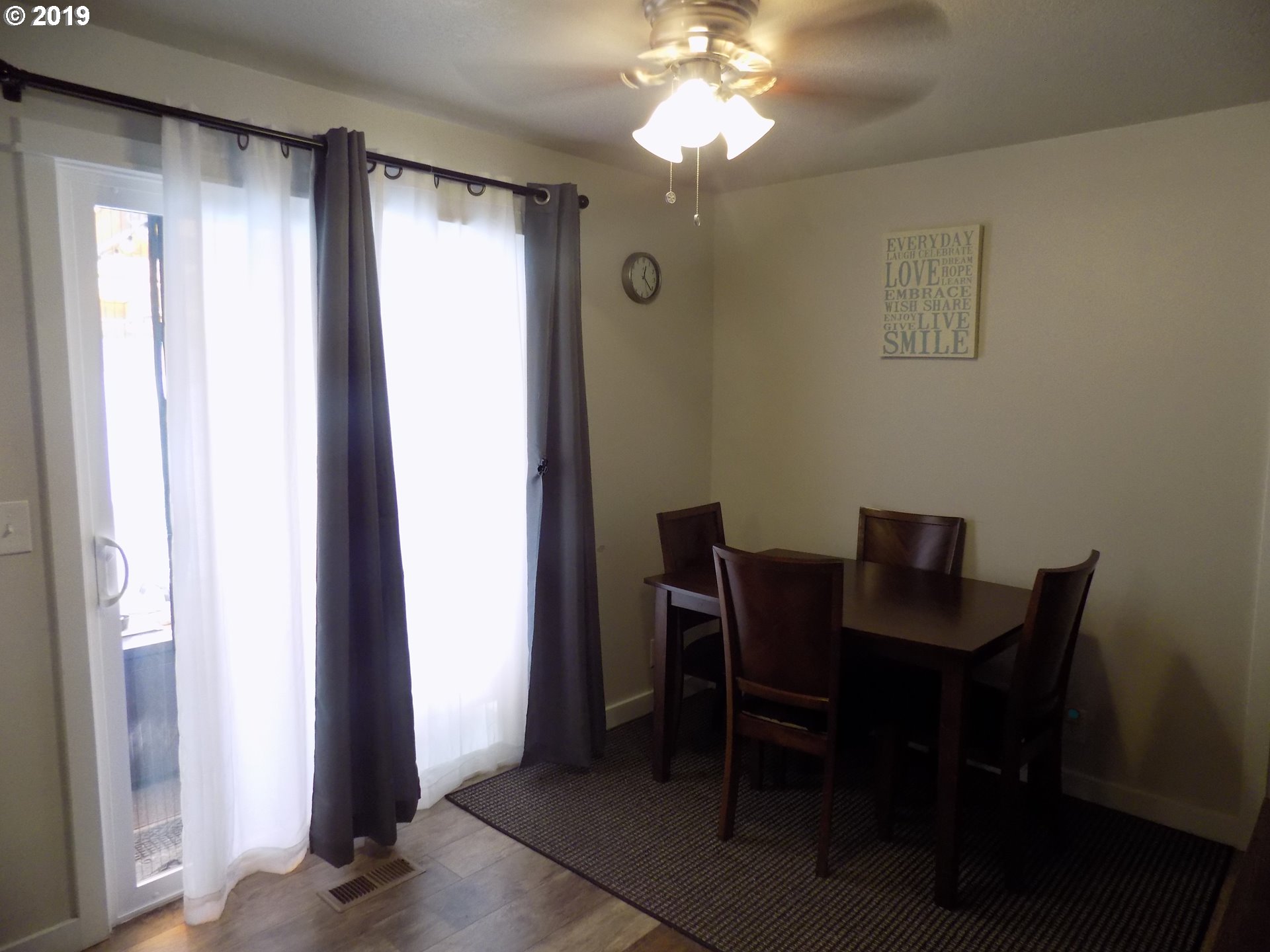 533 South 40th Street Springfield, OR 97478 - Photo 8 of 19 a view of a dining room with furniture and chandelier