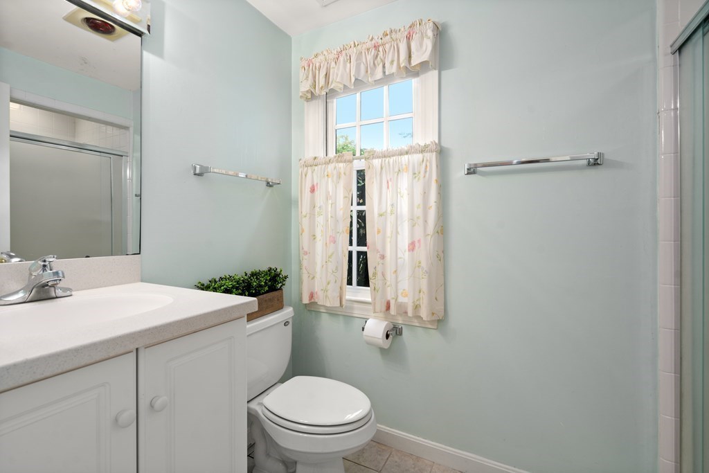 12 Jericho Road, Unit 12 Weston, MA 02493 - Photo 12 of 14 a bathroom with a sink a toilet and shower